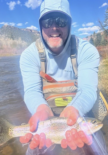 Jesse Cox with rainbow trout